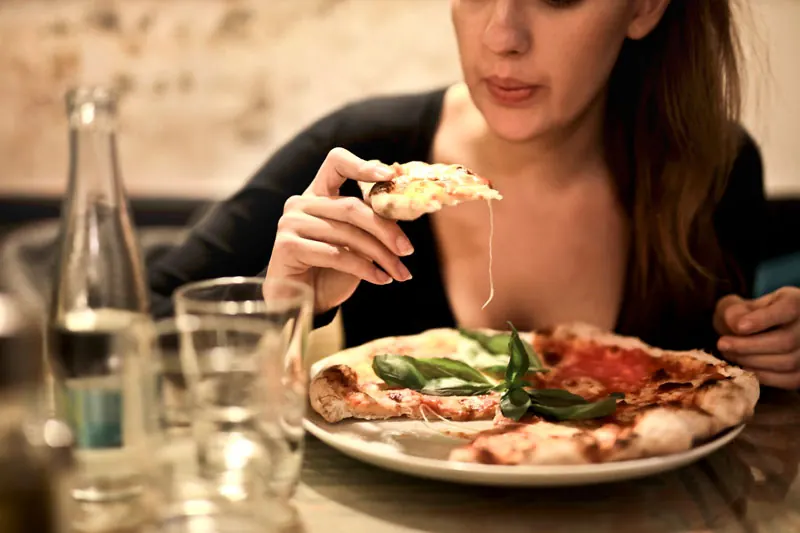 Reheated pizza slice with crispy crust